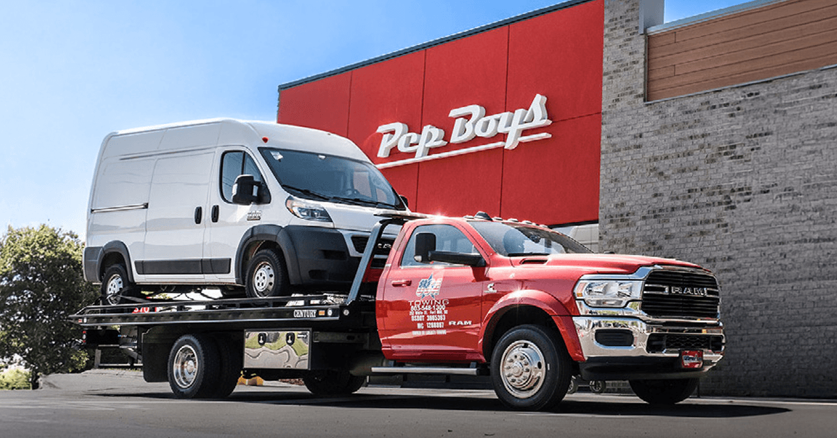 Van being towed to Pep Boys
